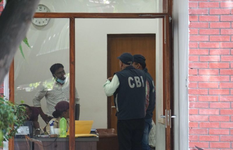 Central Bureau of Investigation (CBI) officials during a raid at the residence of Delhi Deputy Chief Minister Manish Sisodia in connection with alleged irregularities in Delhi Excise Policy, in New Delhi on August 19, 2022. The CBI carried out searches at over 10 locations in Delhi-NCR. (PTI Photo)