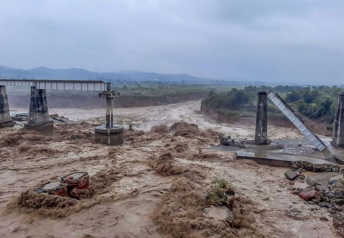 Collapsed portion of railway bridge over the Chakki river after flash flood triggered by heavy monsoon rains, in Dharamshala, Saturday, August 20, 2022. Photograph: PTI Photo