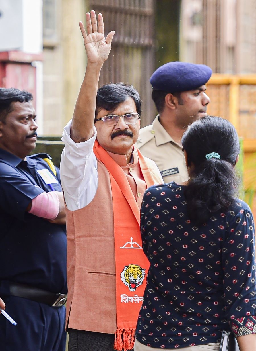 Mumbai: Shiv Sena MP Sanjay Raut waves to his supporters while being produced in a special court in connection with a money laundering case, in Mumbai, Monday, Aug. 8, 2022.  (PTI Photo/Shashank Parade)