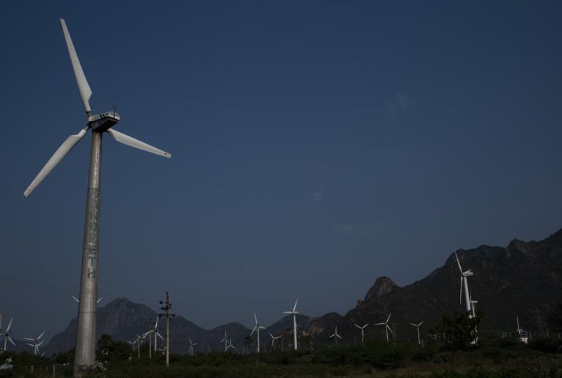 Wind turbines at one of Asia's largest wind farms work with the backdrop of Western Ghats at Aralvaimozhi, southern Tamil Nadu state, India, April 2, 2021. India will miss its renewable energy targets for the end of the year, with experts saying “multiple challenges” including a lack of financial help and taxes on imported components are stalling the clean energy industry. (AP File Photo)
