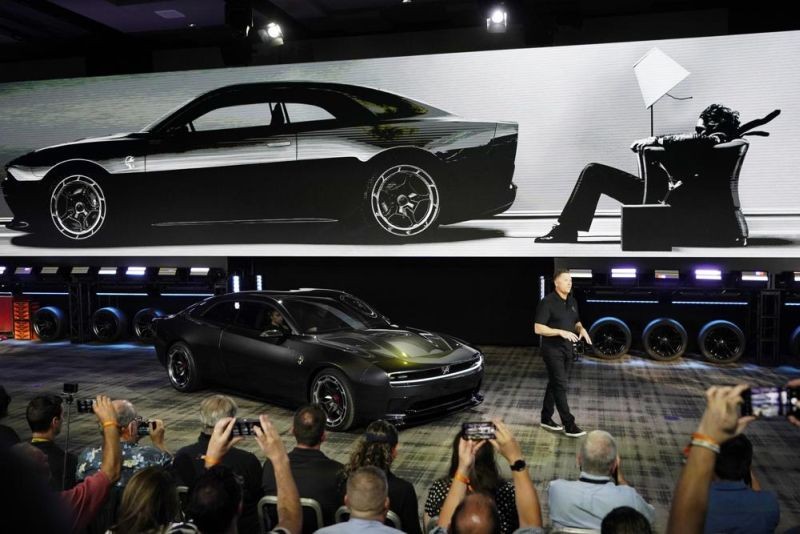 Tim Kuniskis, head of Dodge Brand talks about the Dodge Charger Daytona SRT concept that was unveiled, Wednesday, Aug. 17, 2022, in Pontiac, Mich. (AP Photo)