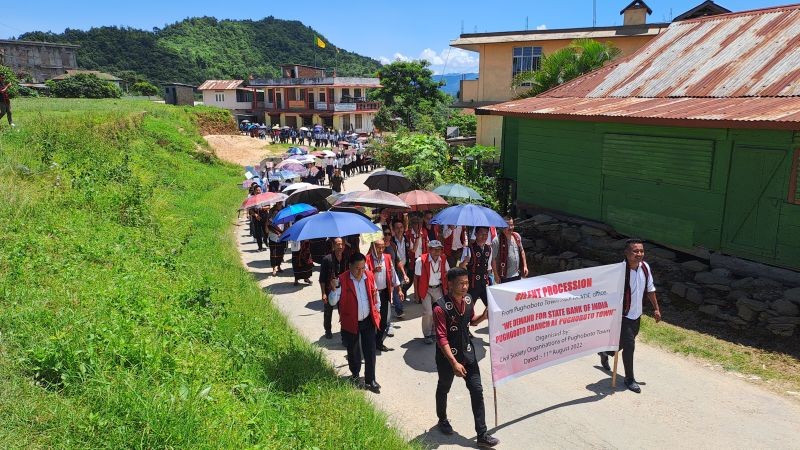 A silent procession was carried out in Pughoboto to demand setting up of an SBI branch there.