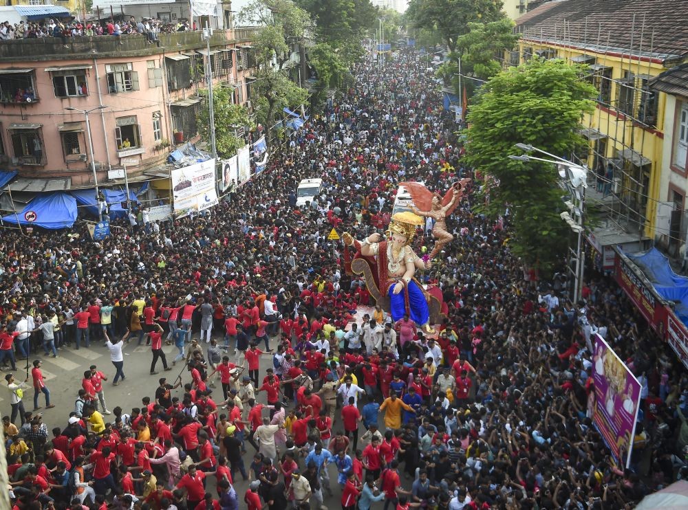 Mumbai: Devotees carry an idol of Lord Ganesh during a procession of 'Chintamani Ganpati' ahead of the Ganesh Chaturthi festival, in Mumbai, Saturday, Aug. 27, 2022. (PTI Photo/Kunal Patil)