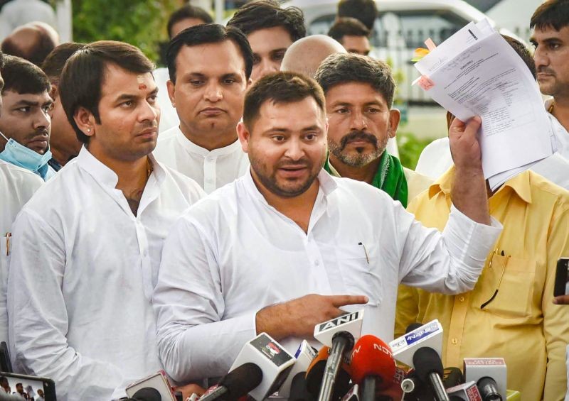 Bihar Deputy Chief Minister Tejashwi Yadav addresses a press conference after the newly-formed 'Mahagathbandhan' government won the motion of confidence, in Patna on August 24, 2022. Bihar Minister Tej Pratap is also seen. (PTI Photo)