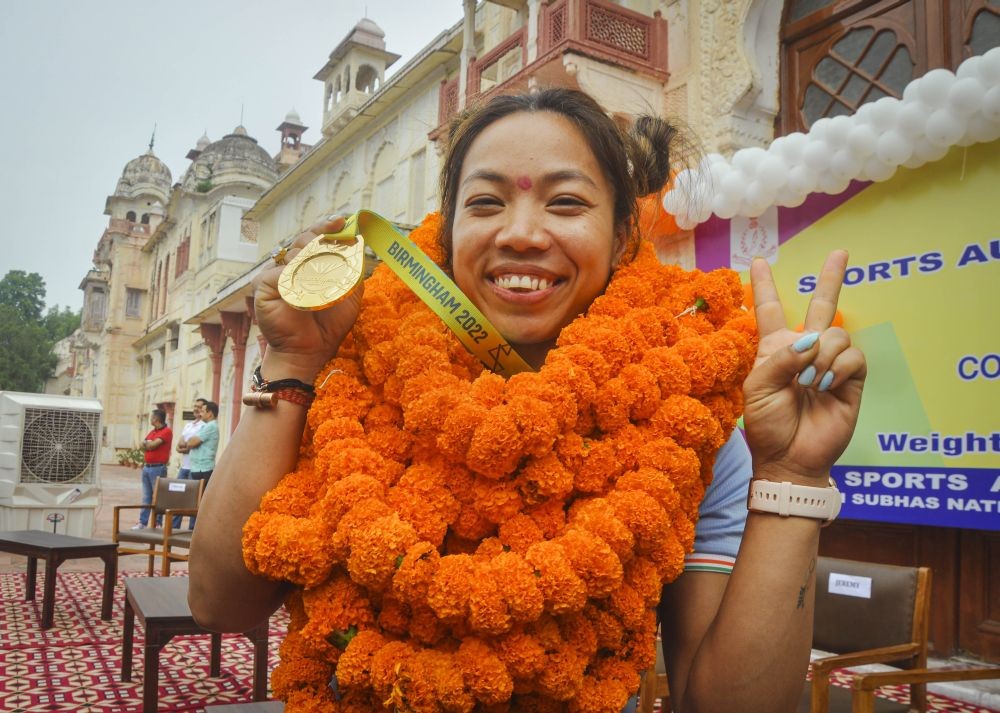 FILE PHOTO: Patiala: Gold medallist weightlifter Mirabai Chanu poses for photographs on her arrival in Patiala, Saturday, Aug. 6, 2022. (PTI Photo)(