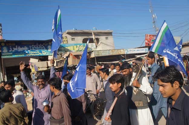 Supporters of a Pakistani political party gather to welcome the party leader for a corner meeting at a village in the Punjab province. (Photo Courtesy: IPS)