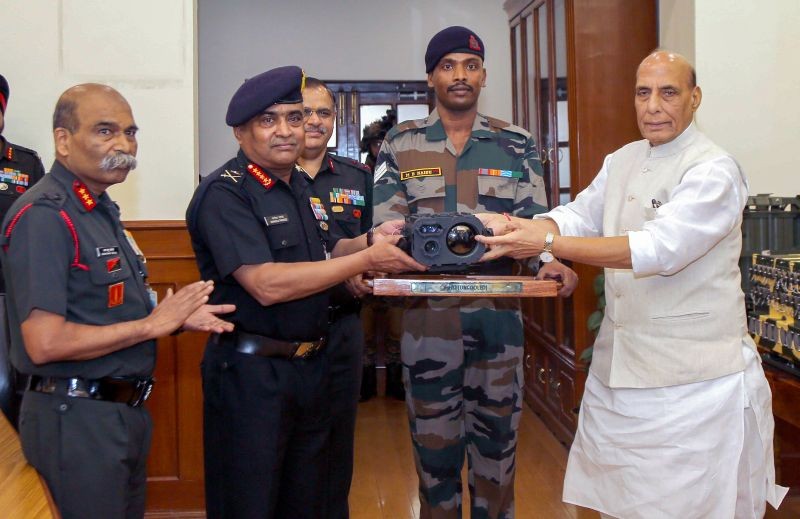 Union Defence Minister Rajnath Singh hands over indigenously-developed Hand Held Thermal Imager (Uncooled) to the Indian Army in the presence of Army Chief General Manoj Pande, in New Delhi on August 16, 2022. (PTI Photo)