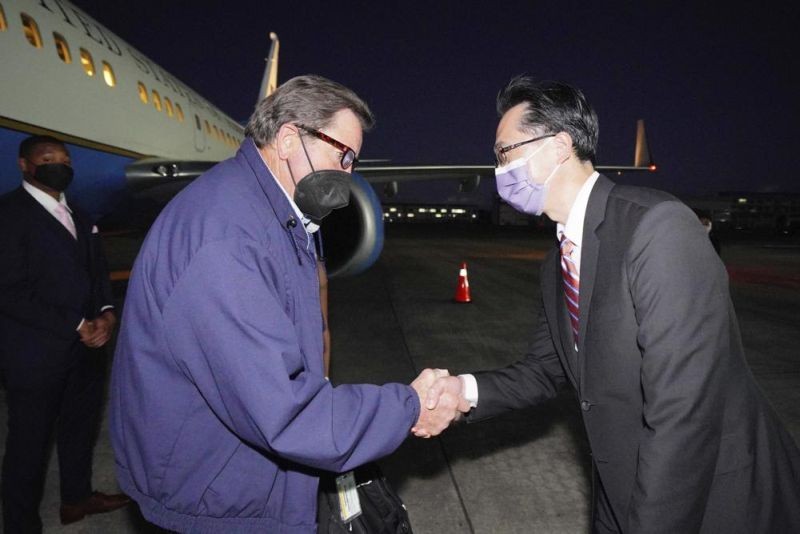 In this photo released by the Taiwan Ministry of Foreign Affairs, from left, U.S. Democratic House members John Garamendi shakes hands with Donald Yu-Tien Hsu, Director-General, dept. of North American Affairs, Taiwan's Ministry of Foreign Affairs after arriving on a U.S. government plane at Songshan airport in Taipei, Taiwan on August 14. (AP Photo)