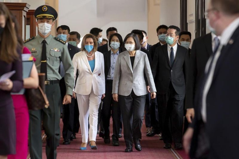 In this photo released by the Taiwan Presidential Office, U.S. House Speaker Nancy Pelosi, center left, and Taiwanese President President Tsai Ing-wen arrive for a meeting in Taipei, Taiwan, Wednesday, Aug. 3, 2022. U.S. House Speaker Nancy Pelosi, meeting top officials in Taiwan despite warnings from China, said Wednesday that she and other congressional leaders in a visiting delegation are showing they will not abandon their commitment to the self-governing island. (AP Photo)
