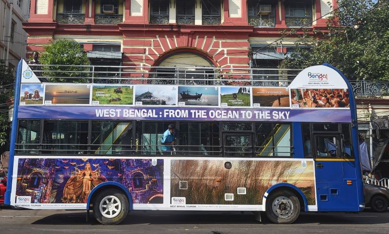 A double-decker bus parked at a city street before a trial run, ahead of Durga Puja festival in Kolkata on August 31, 2022. (PTI Photo)