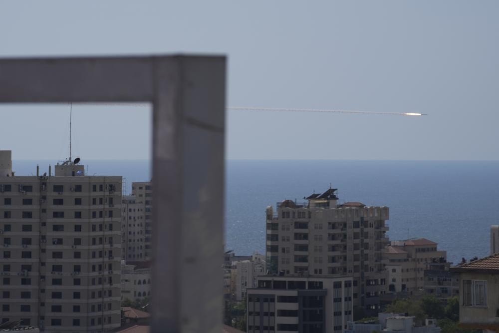 A rocket is launched from the Gaza Strip towards Israel, in Gaza City, Sunday, Aug. 7, 2022. (AP Photo/Hatem Moussa)