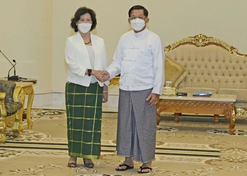 In this image provided by the Military True News Information Team, United Nations special envoy Noeleen Heyzer, left, and State Administration Council Chairman Senior Gen. Min Aung Hlaing shake hands on August 17, 2022, in Naypyitaw, Myanmar. Heyzer, who is making her first mission to the strife-torn Southeast Asian country, met Wednesday with the head of its military-installed government, state television announced. (AP Photo)