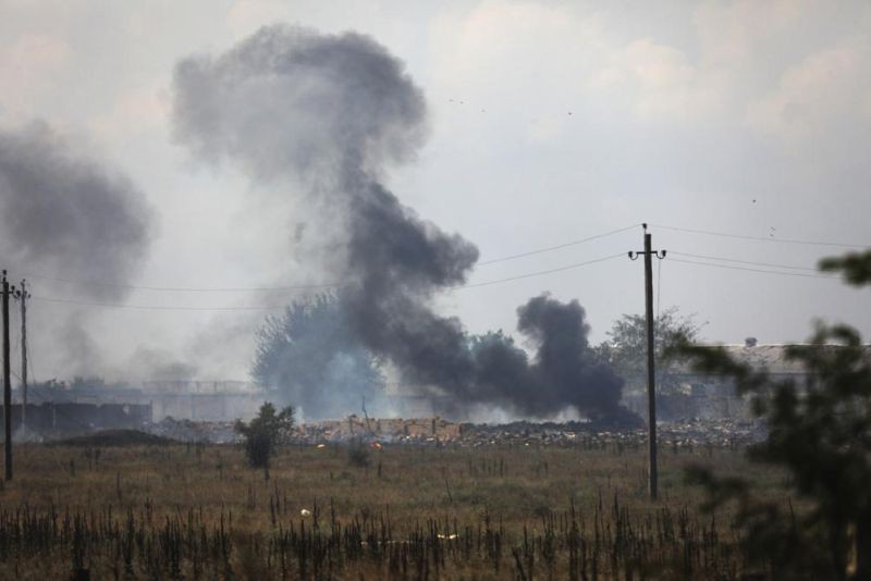 Smoke rises over the site of explosion at an ammunition storage of Russian army near the village of Mayskoye, Crimea, Tuesday, Aug. 16, 2022. Explosions and fires ripped through an ammunition depot in Russian-occupied Crimea on Tuesday in the second suspected Ukrainian attack on the peninsula in just over a week, forcing the evacuation of more than 3,000 people. (AP Photo)