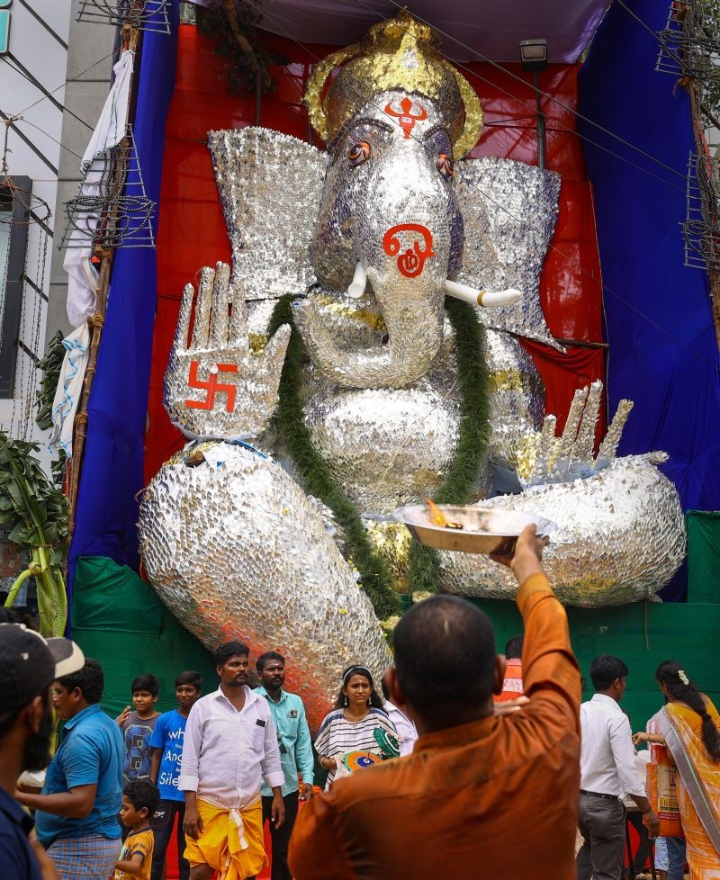 A giant idol of Lord Ganesh prepared using 'Vel', the spear associated with Lord Murugan, made of satin fabric and sticks being displayed at a pandal, on the occasion of Ganesh Chaturthi, in Chennai on August 31, 2022. (PTI Photo)