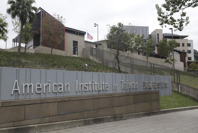 U.S. flag flutters at American Institute in Taiwan, or AIT in Taipei, Taiwan, Wednesday, Nov. 10, 2021. The U.S. government has announced talks with Taiwan, Thursday, Aug. 18, 2022, on a trade treaty in a new sign of support for the self-ruled island democracy claimed by China’s ruling Communist Party as part of its territory. (AP File Photo)