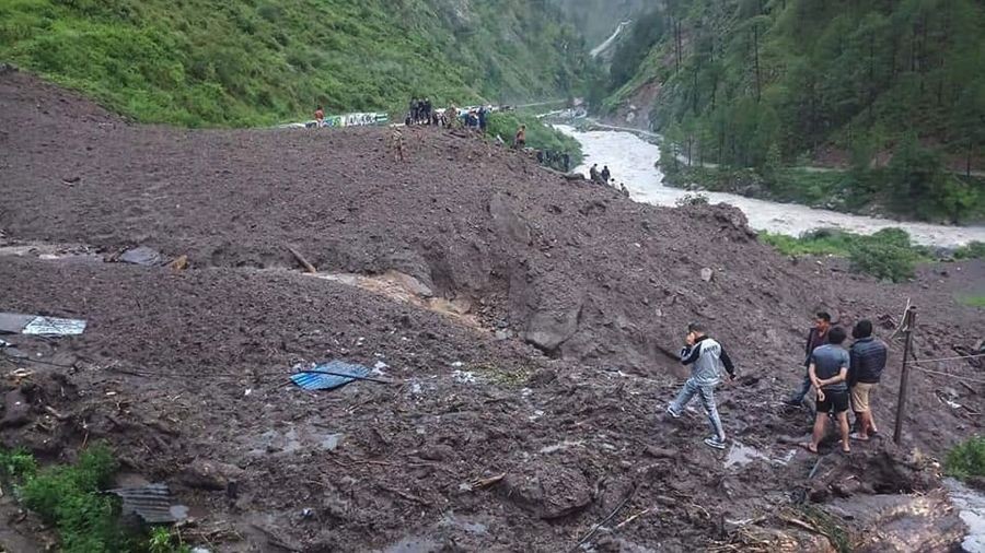 (180726) -- RASUWA, July 26, 2018 (Xinhua) -- Rescuers search for survivors at the site of landslide in Timure, Rasuwa, Nepal, July 26, 2018. At least 4 people were killed and many others missing after landslides struck the small town on Wednesday midnight. (Xinhua) (gj)