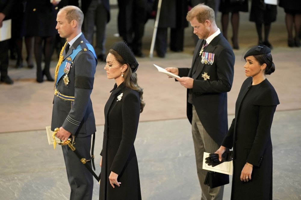 Britain's Prince William, left, Kate, Princess of Wales, second left, Prince Harry, and his wife Meghan, the Duchess of Sussex, right, pay their respects to Queen Elizabeth II as the coffin rests in Westminster Hall for her Lying-in State, in London, Wednesday, Sept. 14, 2022.  AP/PTI(