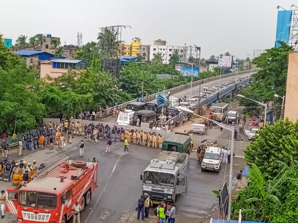 Howrah: Security personnel deployed on the NH 117, barricaded to stop BJP supporters from taking part in the party's 'Nabanna Abhijan' (March to Secretariat), in Howrah district, Tuesday, Sept. 13, 2022. The rally is organised to protest against alleged corrupt practices of the TMC government. (PTI Photo/Swapan Mahapatra)