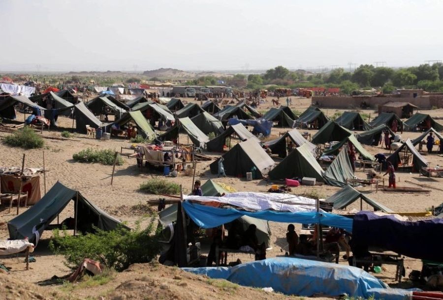 Flood-affected people are seen in tents in Jamshoro district, Sindh province, Pakistan, on Sept. 1, 2022. (Str/Xinhua/IANS)