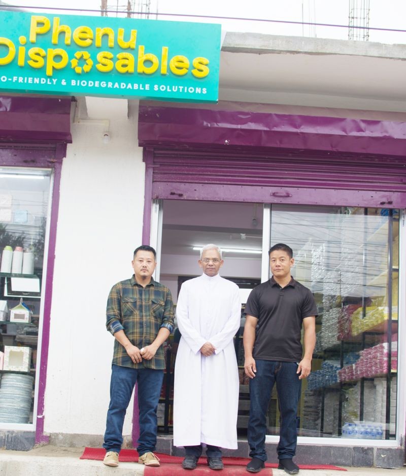 Victor Vikesatuo (left) and Bernard Kesadi (right) with Fr PM Joseph, Parish Priest of Christ King Church, Kohima seen during the opening of Phenu Disposables. (Morung Photo)