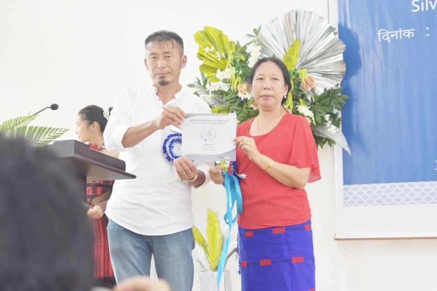 DEO, Sentinenla after the unveiling of the Jubilee souvenir at the All Nagaland Hindi Teachers' Union, Mokokchung Unit Silver Jubilee cum 29 State Level Hindi Divas, 2022 on September 16. (Morung Photo)