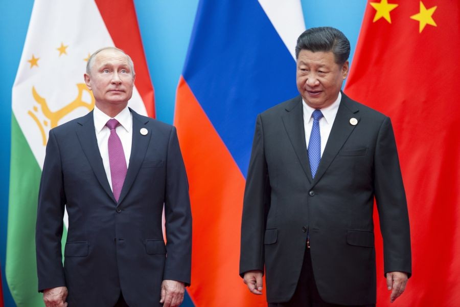 FILE - Chinese President Xi Jinping, right, and Russian President Vladimir Putin pose for a photo at the Shanghai Cooperation Organization (SCO) Summit in Qingdao in eastern China's Shandong Province on June 10, 2018. President Xi Jinping is using his first trip abroad since the start of the pandemic to promote China's strategic ambitions at a summit with Putin and other leaders of a Central Asian security group. AP/PTI