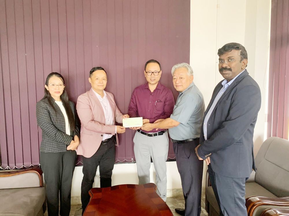 EduCentre Founder, Lezo Putsure (second from left) receives the cheque to initiate the launching of EDC at IDAN office, Kohima on September 14.