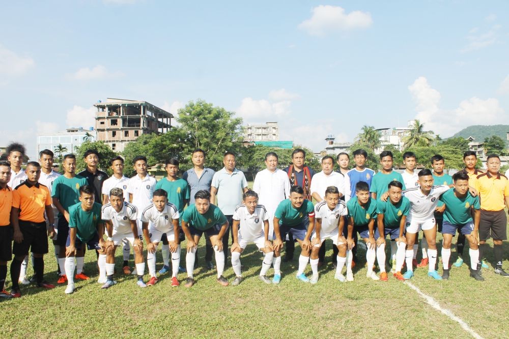 Players from Sovima United FC (White) and Medziphema United FC (Green) with Jacob Zhimomi, Minister, PHED and officials at Local Ground, Chümoukedima on September 17. (Morung Photo)
