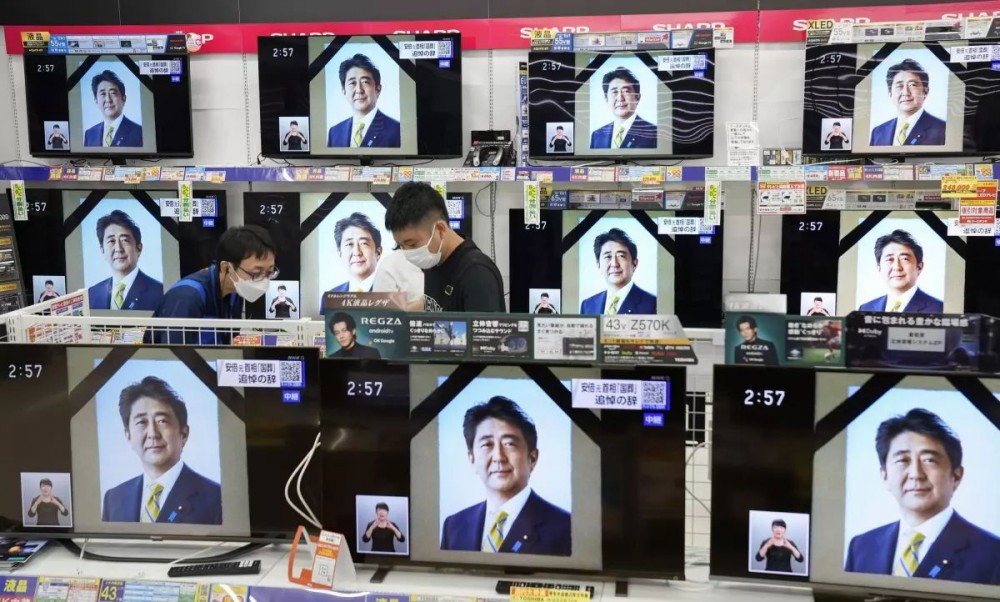 TV screens show the news programs reporting the state funeral for former Japanese Prime Minister Shinzo Abe, in Fukuoka, western Japan, on Tuesday, Sept. 27, 2022. (Kyodo News via AP)(Uncredited / Associated Press)