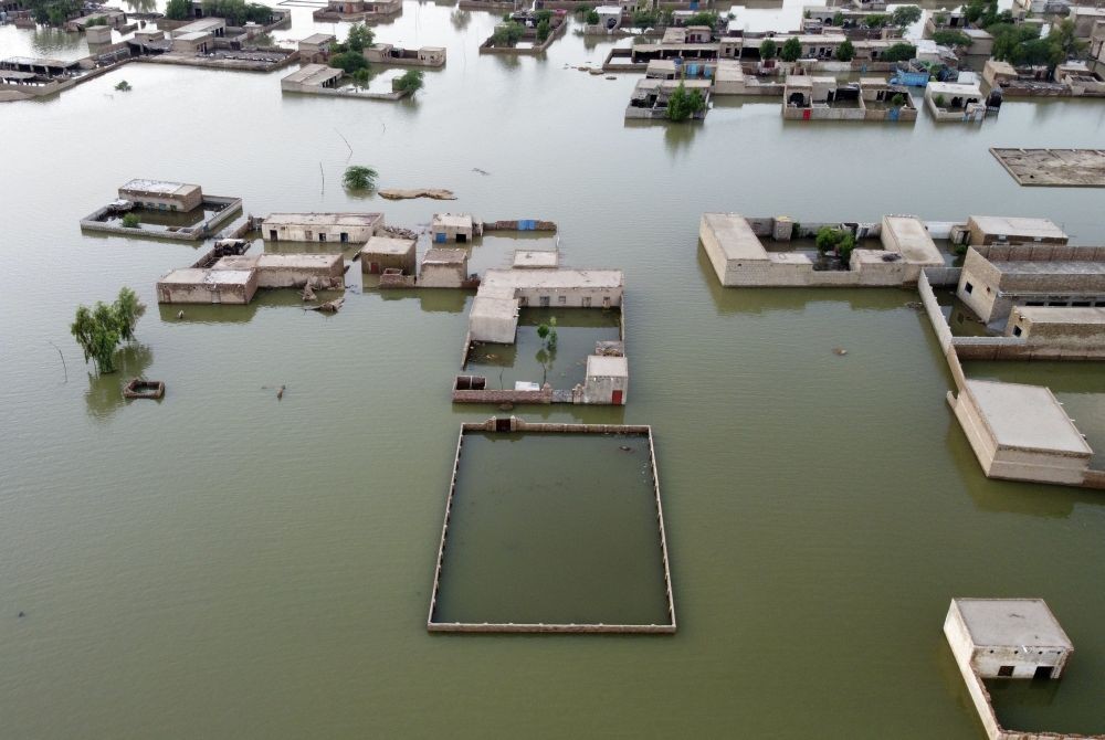 Homes are surrounded by floodwaters in Jaffarabad, a district of Pakistan's southwestern Baluchistan province, Thursday, Sept. 1, 2022. Pakistani health officials on Thursday reported an outbreak of waterborne diseases in areas hit by recent record-breaking flooding, as authorities stepped up efforts to ensure the provision of clean drinking water to hundreds of thousands of people who lost their homes in the disaster. AP/PTI
