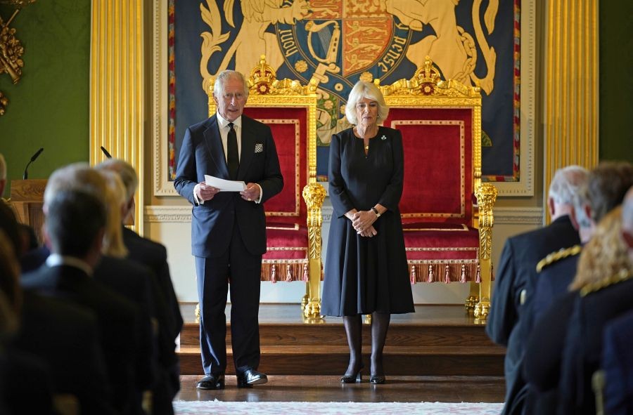 Britain's King Charles III, with the Queen Consort, speaks after receiving a message of condolence from Alex Maskey, Speaker of the Northern Ireland Assembly, at Hillsborough Castle, Belfast, Tuesday Sept. 13, 2022, following the death of Queen Elizabeth II. King Charles III and Camilla, the Queen Consort, flew to Belfast from Edinburgh on Tuesday, the same day the queen‚Äôs coffin will be flown to London from Scotland. AP/PTI