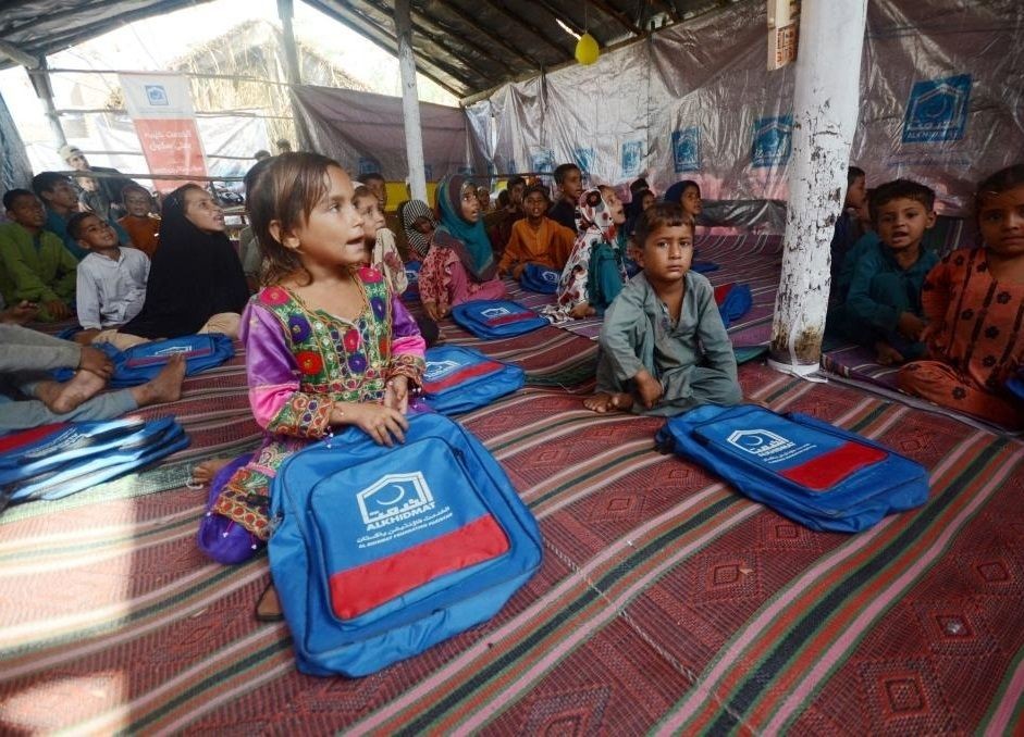 Flood-affected children attend a class at a makeshift school on the outskirts of Peshawar, Pakistan, on Sept. 22, 2022.. (Str/Xinhua/IANS)