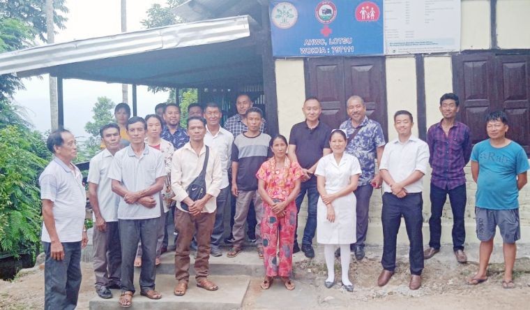 Dr Zuben Kikon with Dr Thungjanthung Ovung, his medical staff and council members of Lotsu Village during the dedication programme on September 3.