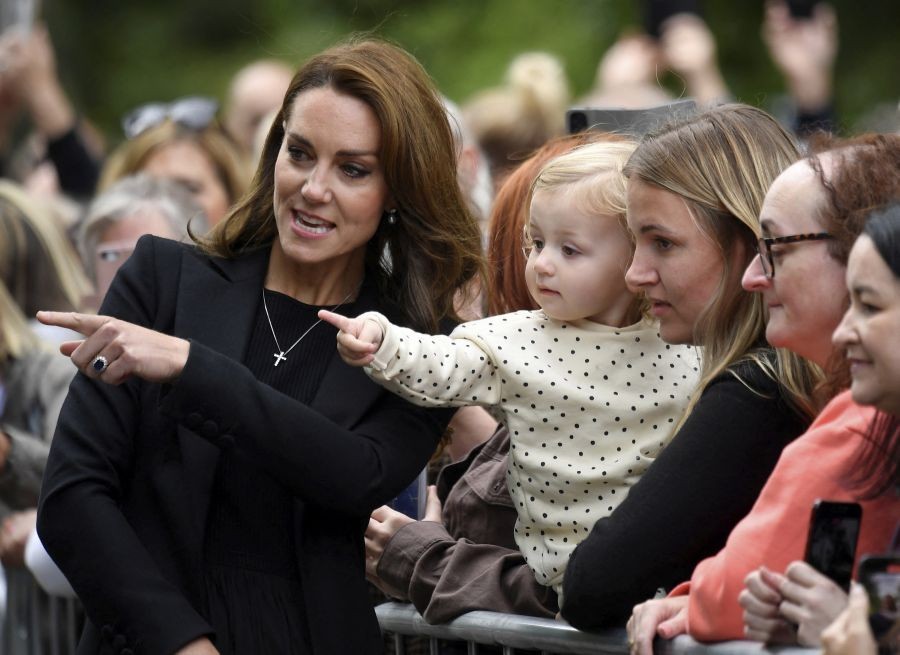 Kate, Princess of Wales reacts with well-wishers as she and Prince William, view floral tributes left by members of the public, in memory of late Queen Elizabeth II, at the Sandringham Estate, in Norfolk, England, Thursday, Sept. 15, 2022.  Queen Elizabeth II, Britain's longest-reigning monarch died Thursday Sept. 8, 2022, after 70 years on the throne. AP/PTI(