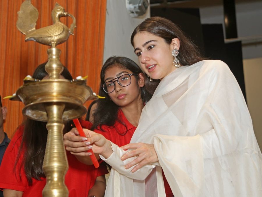 New Delhi: Bollywood actress Sara Ali Khan lights a lamp during a session on '#NoShame' (Stop Non Consensual Intimate Image Abuse) at Miranda House college in New Delhi on Tuesday, Oct. 11, 2022. (Photo: Anupam Gautam/IANS)