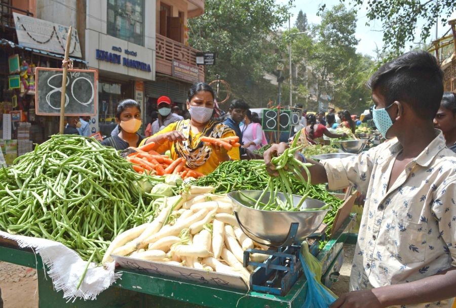 Bengaluru : People shopping vegetables and fruits at Avenue Road, after the Karnataka government eased restrictions amid ongoing Coronavirus lockdown, in Bengaluru on Tuesday, June 22, 2021 (Photo: IANS)