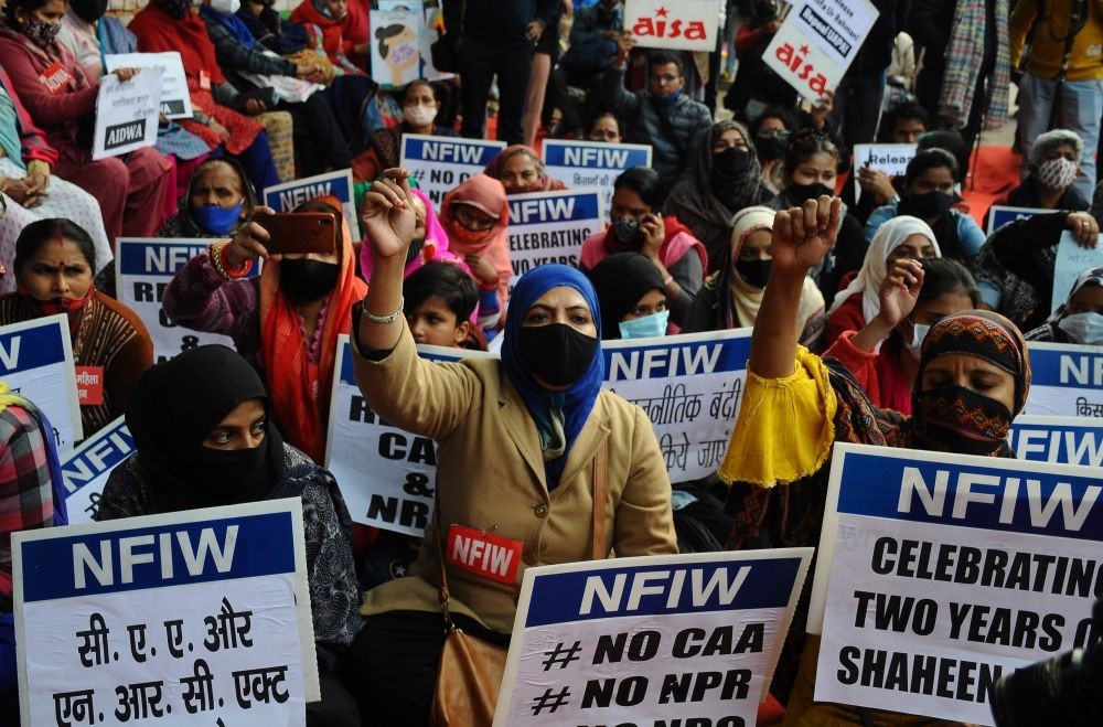 New Delhi: Activists hold placards celebrate two years of Shaheen Bagh protest against CAA and NRC bill, at Jantar Mantar in New Delhi on Thursday, December 16, 2021. (Photo: Qamar Sibtain/IANS)