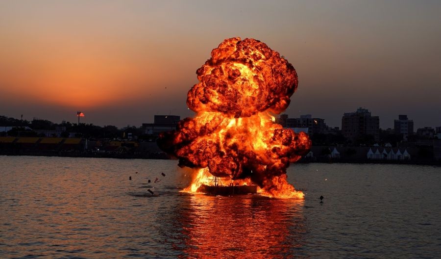 Ahmadabad :Fire and smoke rise after an explosive blast as Part rehearsal at Sabarmati River Front for upcoming Air show , as part of defence expo 2022 in Ahmedabad on Saturday, Oct. 15, 2022.(PHOTO:IANS/Siddharaj Solanki)