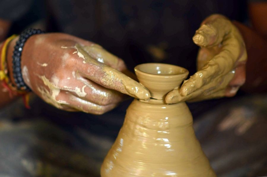 Nagaon: A potter makes earthen lamps ahead of the Diwali festival in Nagaon District of Assam, India on Oct. 18, 2022. (Photo: Anuwar hazarika/IANS)