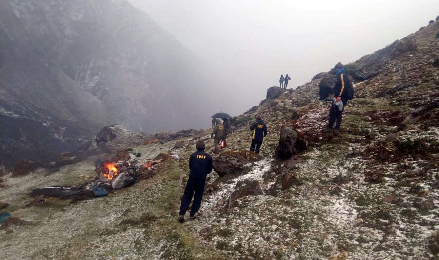 Phata: SDRF team during rescue operation after a helicopter carrying 7 pilgrims of Kedarnath crashes in Phata, Uttarakhand on Tuesday, Oct. 18, 2022. All seven died in the accident. (Photo: IANS)