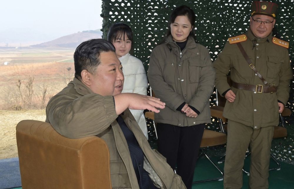 Pyongyang: North Korean leader Kim Jong-un (front), accompanied by his wife Ri Sol-ju (C, rear) and his daughter (L, rear), speaks during the launch of a new type of the Hwasong-17 intercontinental ballistic missile (ICBM) at Pyongyang International Airport on Nov. 18, 2022. (Yonhap/END/IANS)