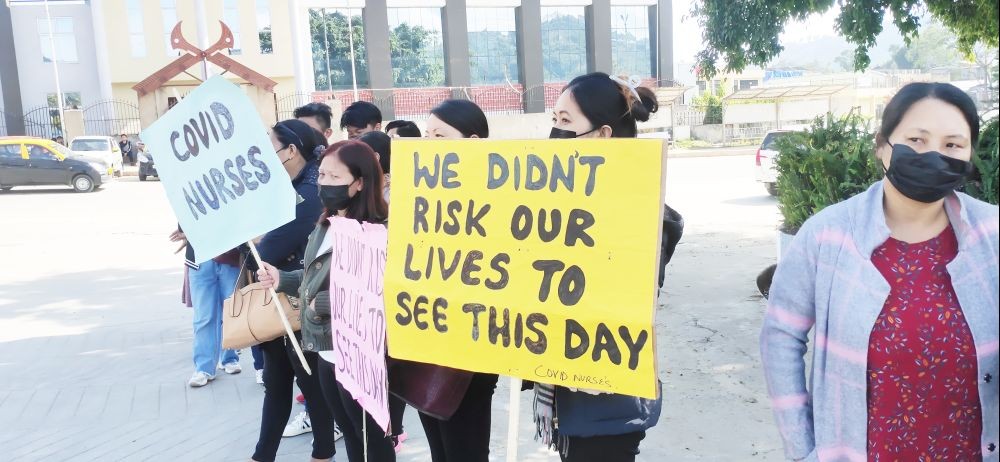 Staff nurses holding up placards during the sit in protest in Kohima on November 9. (Morung Photo)