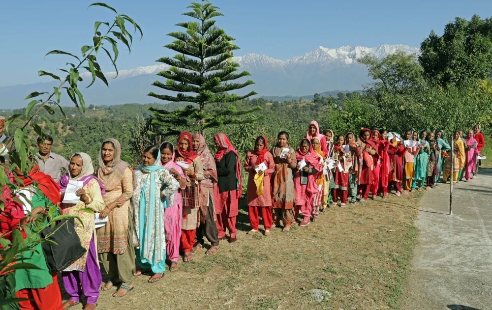 Kangra : Voters in a queue waiting for their turn to cast the vote for Himachal Pradesh Assembly elections at Jalot Village of Kangra district on Saturday, November 12, 2022. (Photo:Sanjay Baid/IANS)