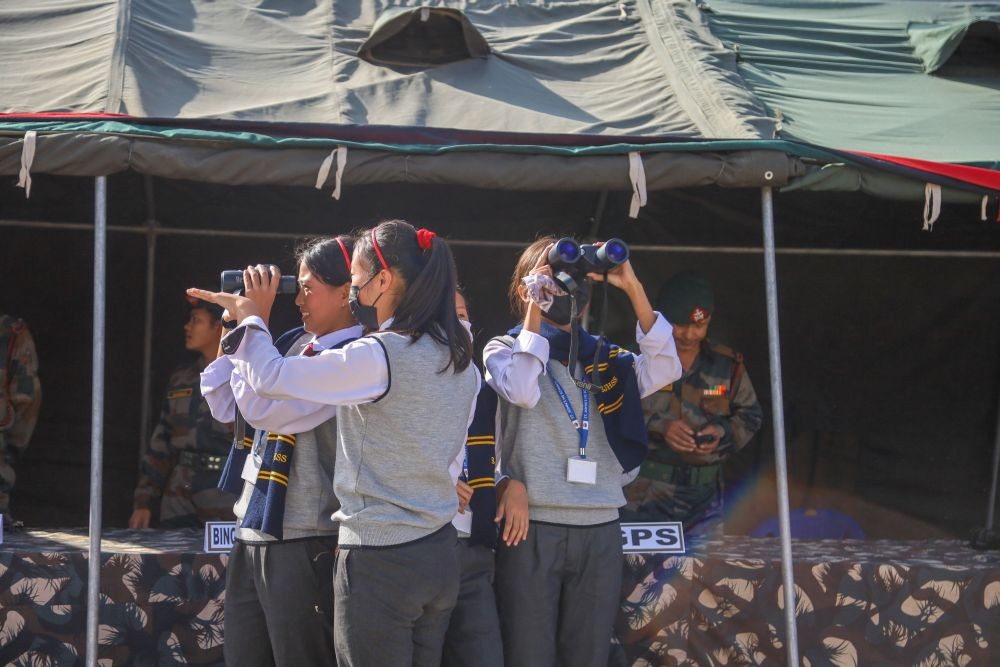 An NCC cadet peers through a binocular during the 28 AR’s equipment display at Parade Ground, Tuensang on November 7. (Morung Photo)