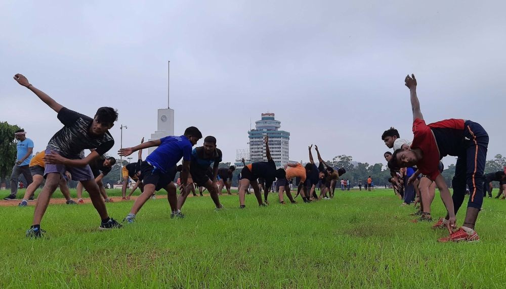 Patna : Youth during an exercise in Gandhi maidan after its gates opened for morning walkers after restrictions of COVID-induced lockdown eased in Patna on Wednesday June 23, 2021.(Photo: AFTAB ALAM SIDDIQUI/ IANS)