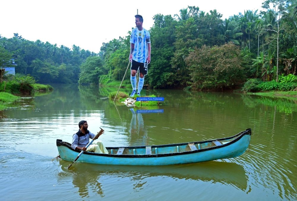 Kozhikode:A boat passing a giant 30-foot-long cutout of Lionel Messi erected by Argentina fans in Pullavoor in Kozhikode district in Kerala on 1 November 2022. (Photo: Arun chandrabos/IANS)