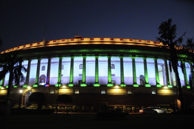 A view of the Parliament illuminated in tricolor during the ongoing winter session, in New Delhi on Wednesday, December 14, 2022. (IANS Photo)