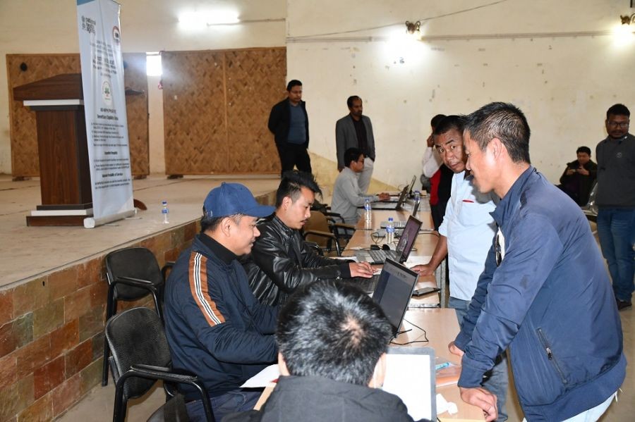 Beneficiaries registering for the CMHIS/PMJAY, also seen in the picture is DC Wokha monitoring the camp.