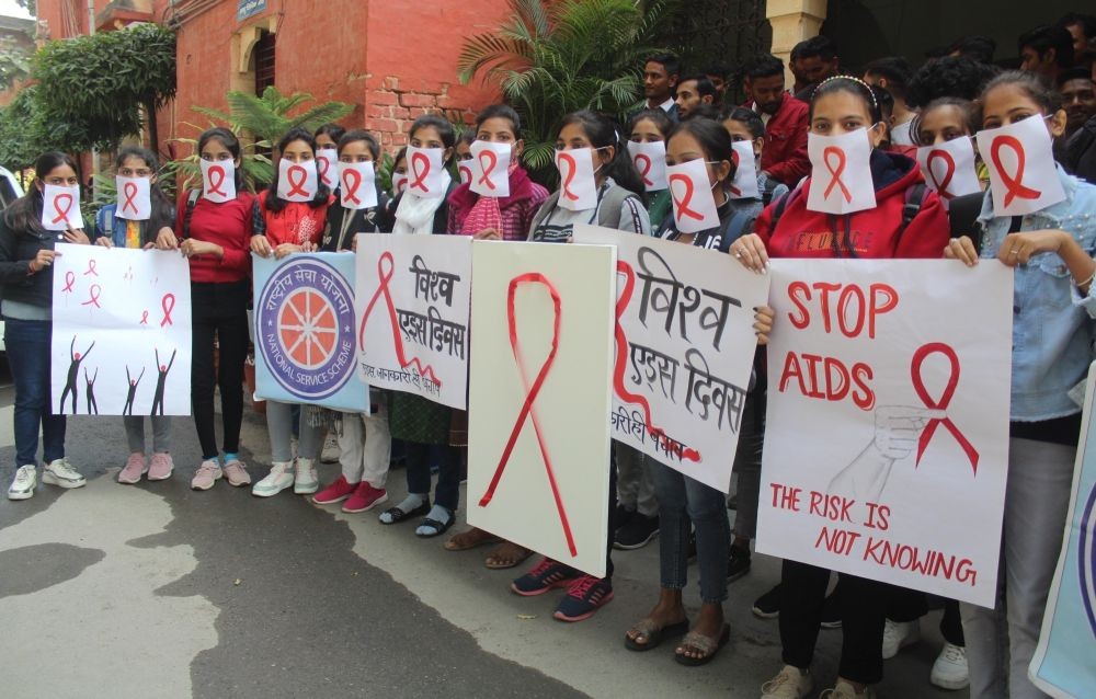 Meerut: Students hold placards and participate in an awareness campaign to mark World AIDS Day, at NAS college in Meerut on Thursday, Dec. 01, 2022. (Photo: IANS)