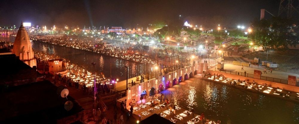 Ayodhya : Devotees light earthen lamps on the bank of river Saryu during deepotsav festival in Ayodhya on Wednesday October 03,2021.(Photo:IANS)
